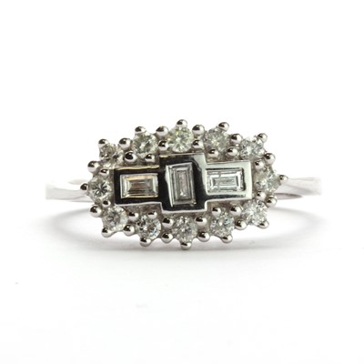 Lot 52 - An 18ct white gold three stone diamond cluster ring