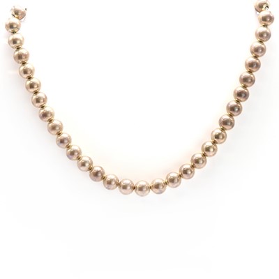 Lot 174 - A sterling silver bead necklace, by Tiffany & Co