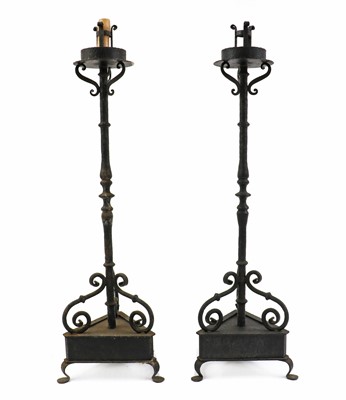 Lot 476 - A pair of wrought iron torcheres