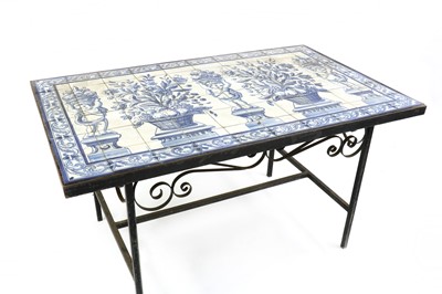 Lot 475 - A wrought iron table