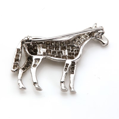 Lot 221 - An 18ct white gold diamond set horse brooch, by Alabaster and Wilson