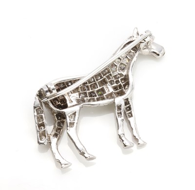 Lot 221 - An 18ct white gold diamond set horse brooch, by Alabaster and Wilson