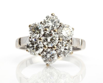 Lot 367 - A white gold diamond flowerhead ring