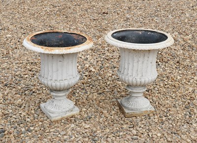Lot 440 - A pair of cast iron campana urns