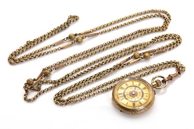 Lot 402 - A gold top wind open faced fob watch