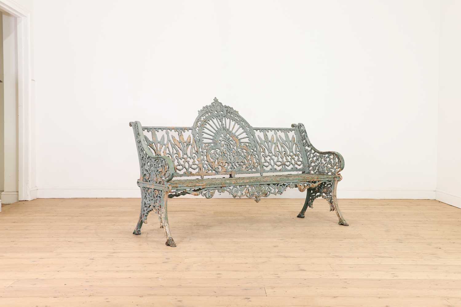 Lot 668 - A Victorian painted cast iron garden bench