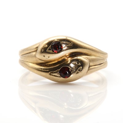 Lot 374 - A 9ct gold and garnet entwined snake ring