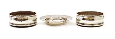 Lot 95 - A pair of silver wine coasters