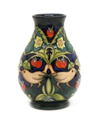 Lot 134 - A Moorcroft pottery 'Strawberry Thief' pattern vase
