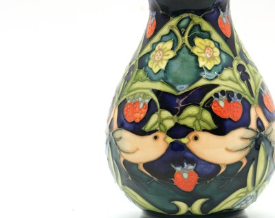 Lot 134 - A Moorcroft pottery 'Strawberry Thief' pattern vase