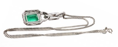 Lot 185 - An 18ct white gold Colombian emerald and diamond pendant and chain