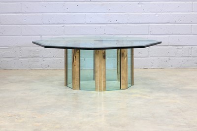 Lot 428 - An American brass-lacquered and glass coffee table