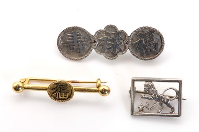 Lot 280 - Three gold and silver brooches