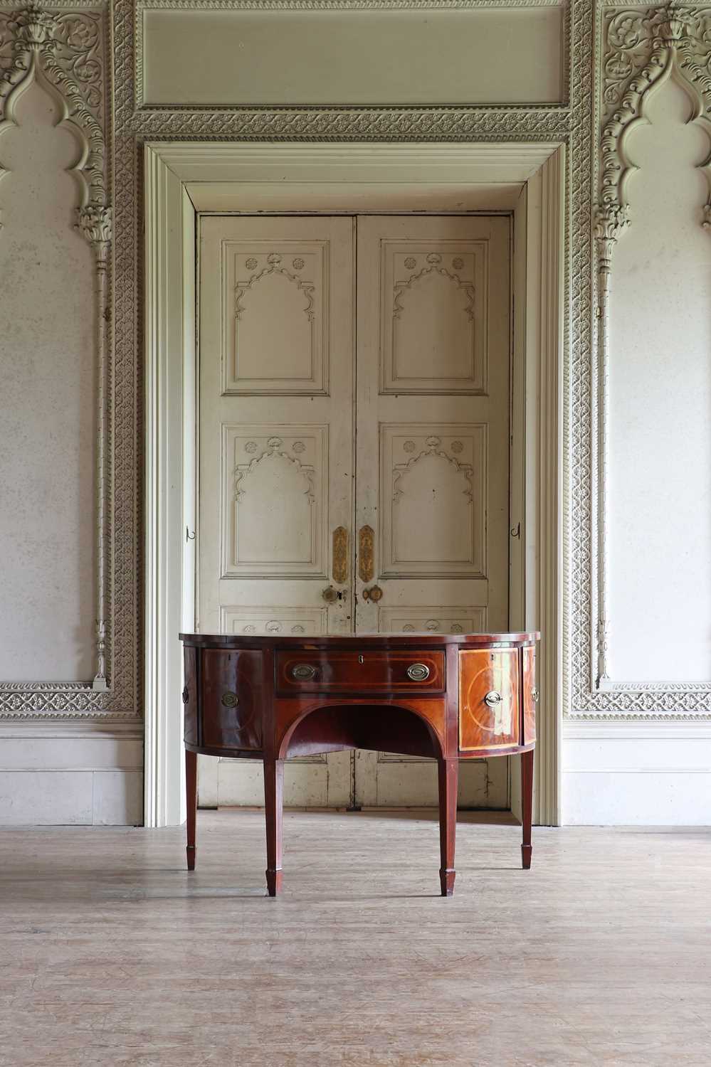 Lot 30 - ☘ A late George III mahogany bow-front sideboard