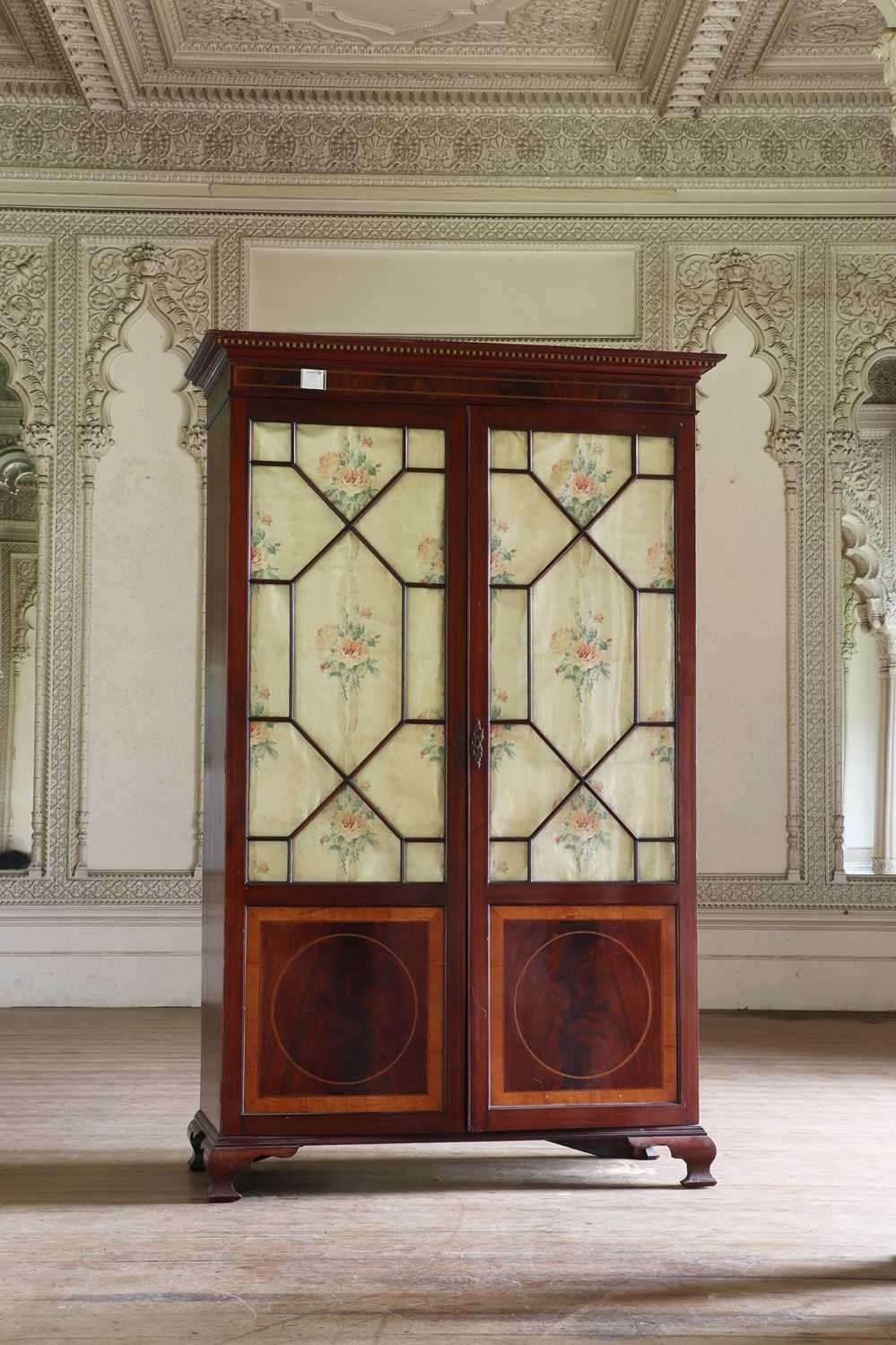 Lot 136 - ☘ A satinwood-banded mahogany hanging cupboard