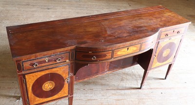 Lot 21 - A George IV satinwood and mahogany bow-front sideboard