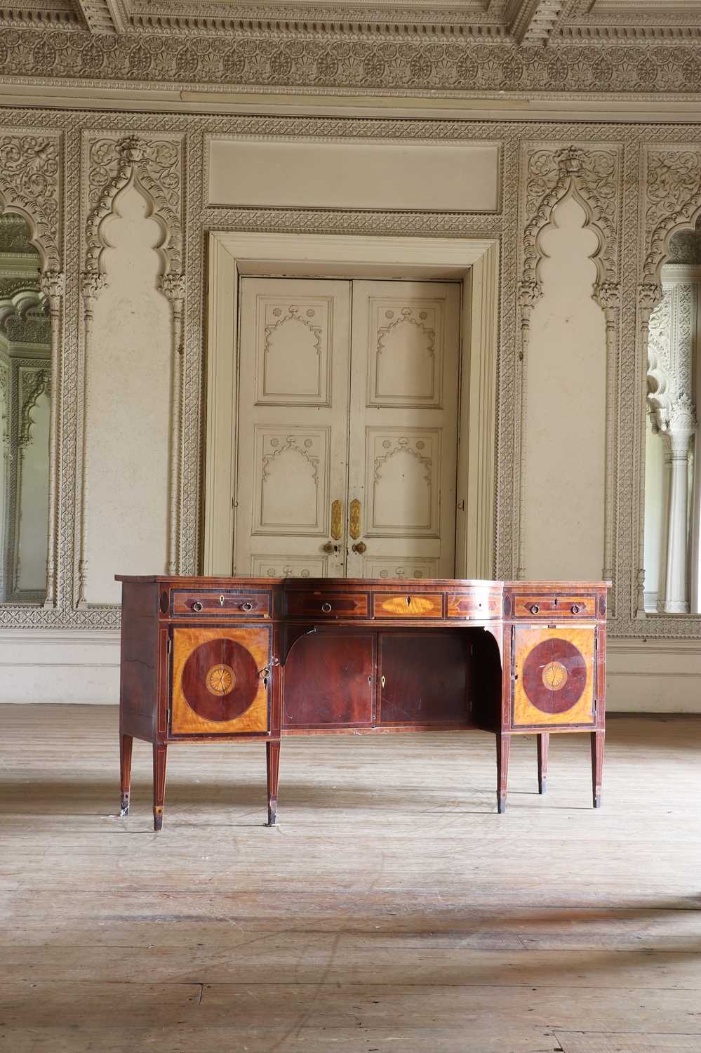 Lot 21 - A George IV satinwood and mahogany bow-front sideboard