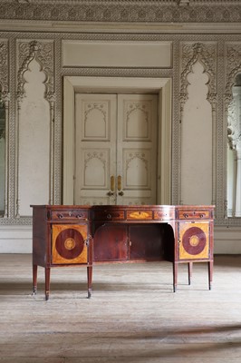 Lot 21 - A George IV satinwood and mahogany bow-front sideboard