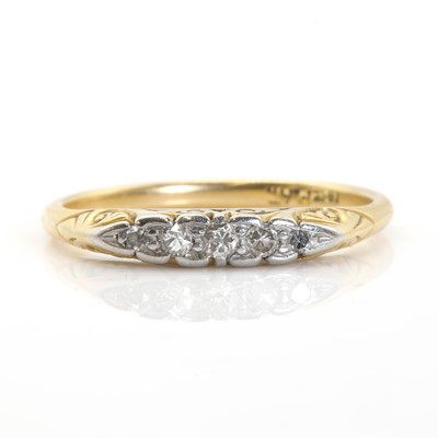 Lot 60 - A gold five stone diamond carved head ring