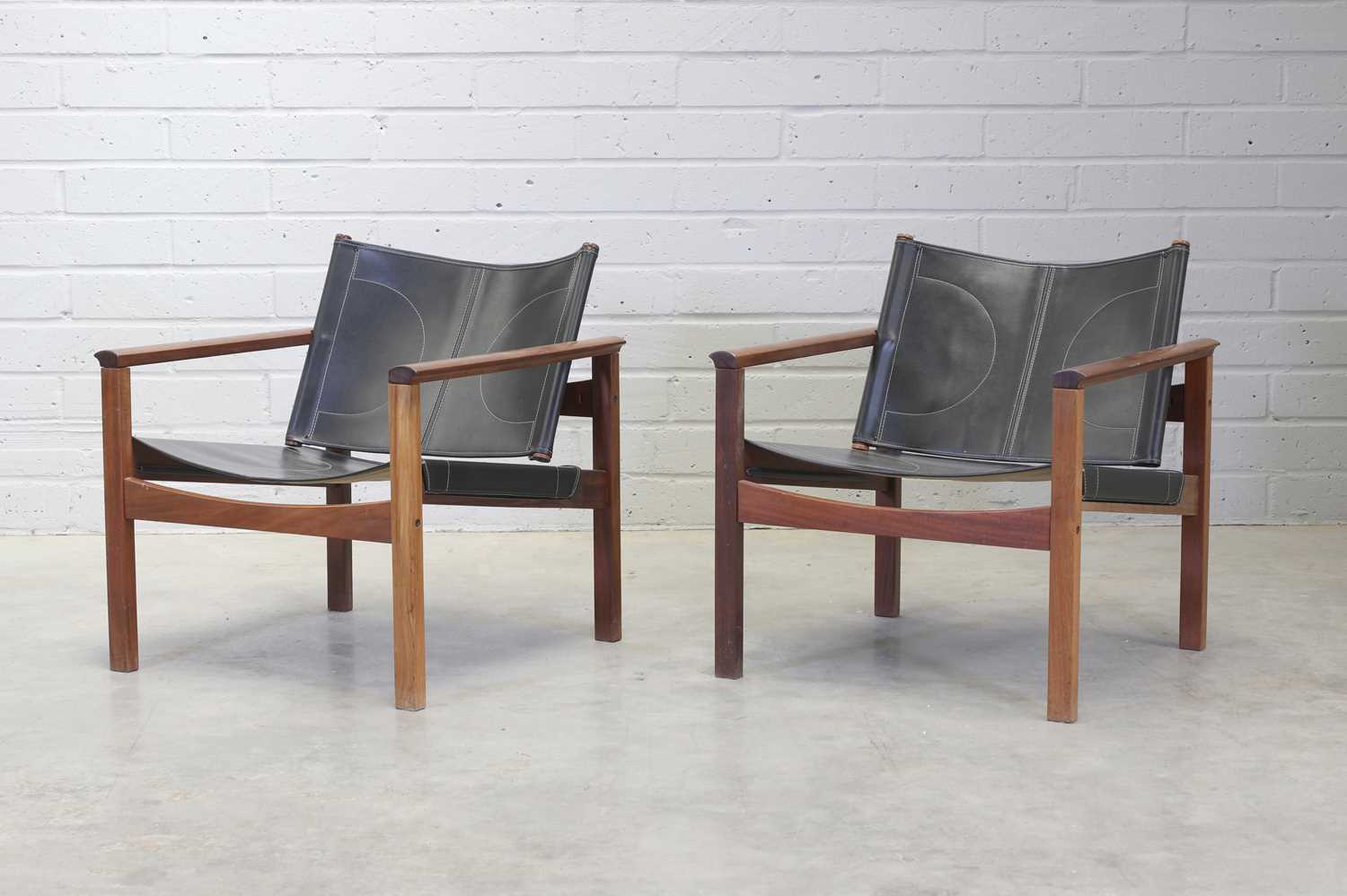 Lot 239 - A pair of teak 'Peg Lev' armchairs