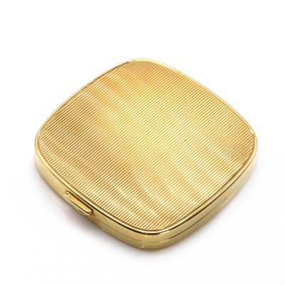 Lot 88 - A gold flat section hinged powder compact