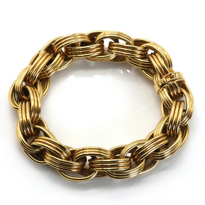 Lot 113 - A gold oval link necklace and bracelet suite, by Tiffany & Co.