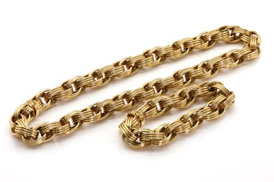 Lot 66 - A gold oval link necklace and bracelet suite, by Tiffany & Co.