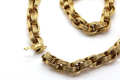 Lot 113 - A gold oval link necklace and bracelet suite, by Tiffany & Co.