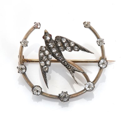 Lot 24 - A diamond set swallow and crescent brooch