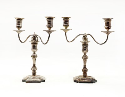 Lot 19 - A pair of silver twin-light candelabra