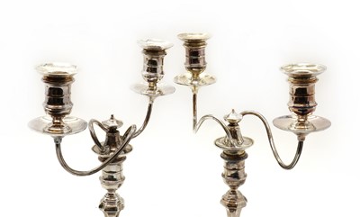 Lot 19 - A pair of silver twin-light candelabra