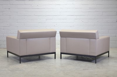 Lot 250 - A pair of Christian Liaigre cream leather armchairs