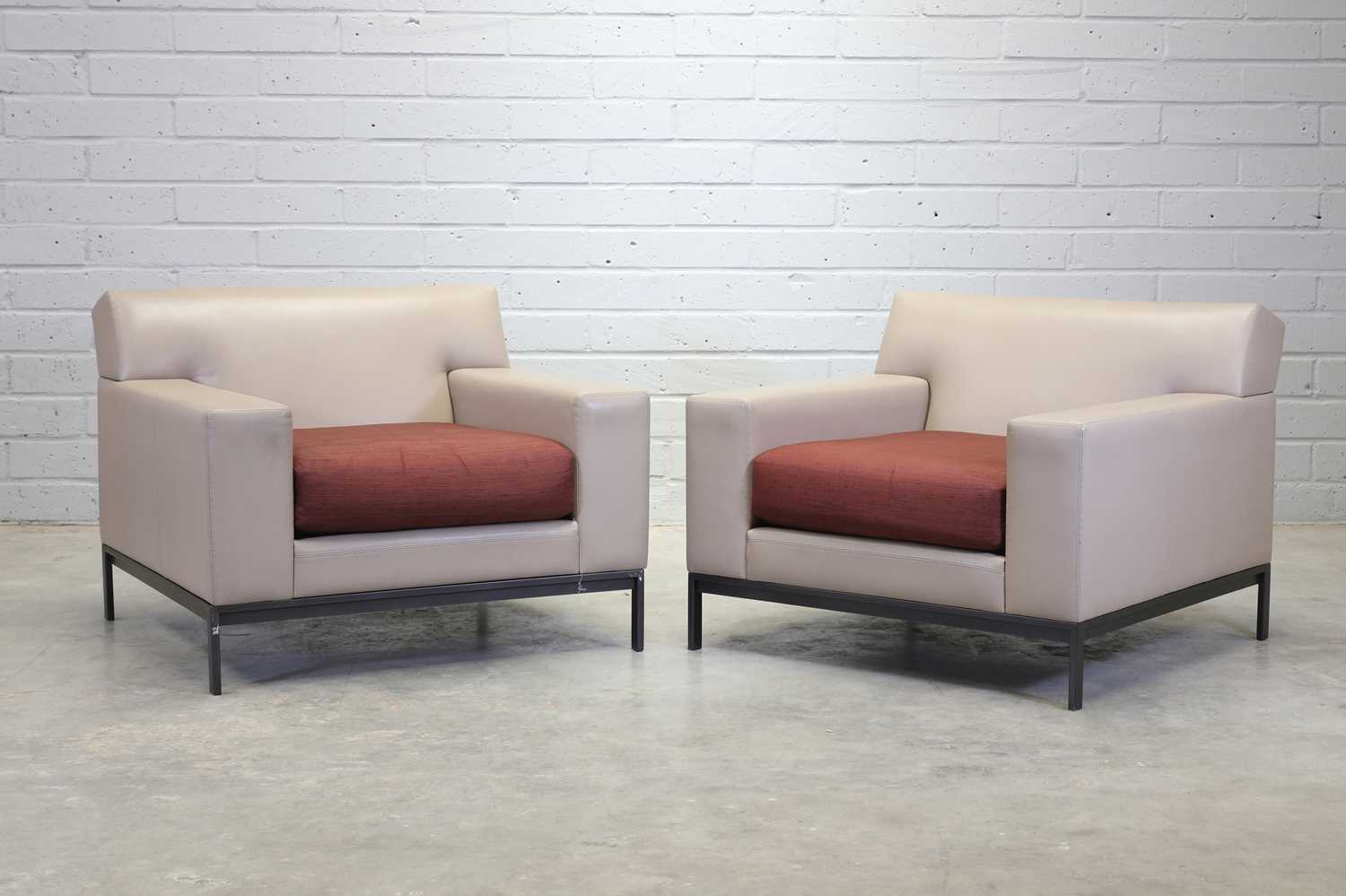 Lot 250 - A pair of Christian Liaigre cream leather armchairs