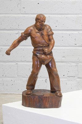 Lot 223 - A German carved cedar sculpture of a farmer sowing