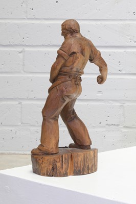 Lot 223 - A German carved cedar sculpture of a farmer sowing