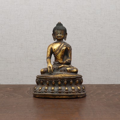 Lot 234 - A Chinese gilt-bronze Buddha