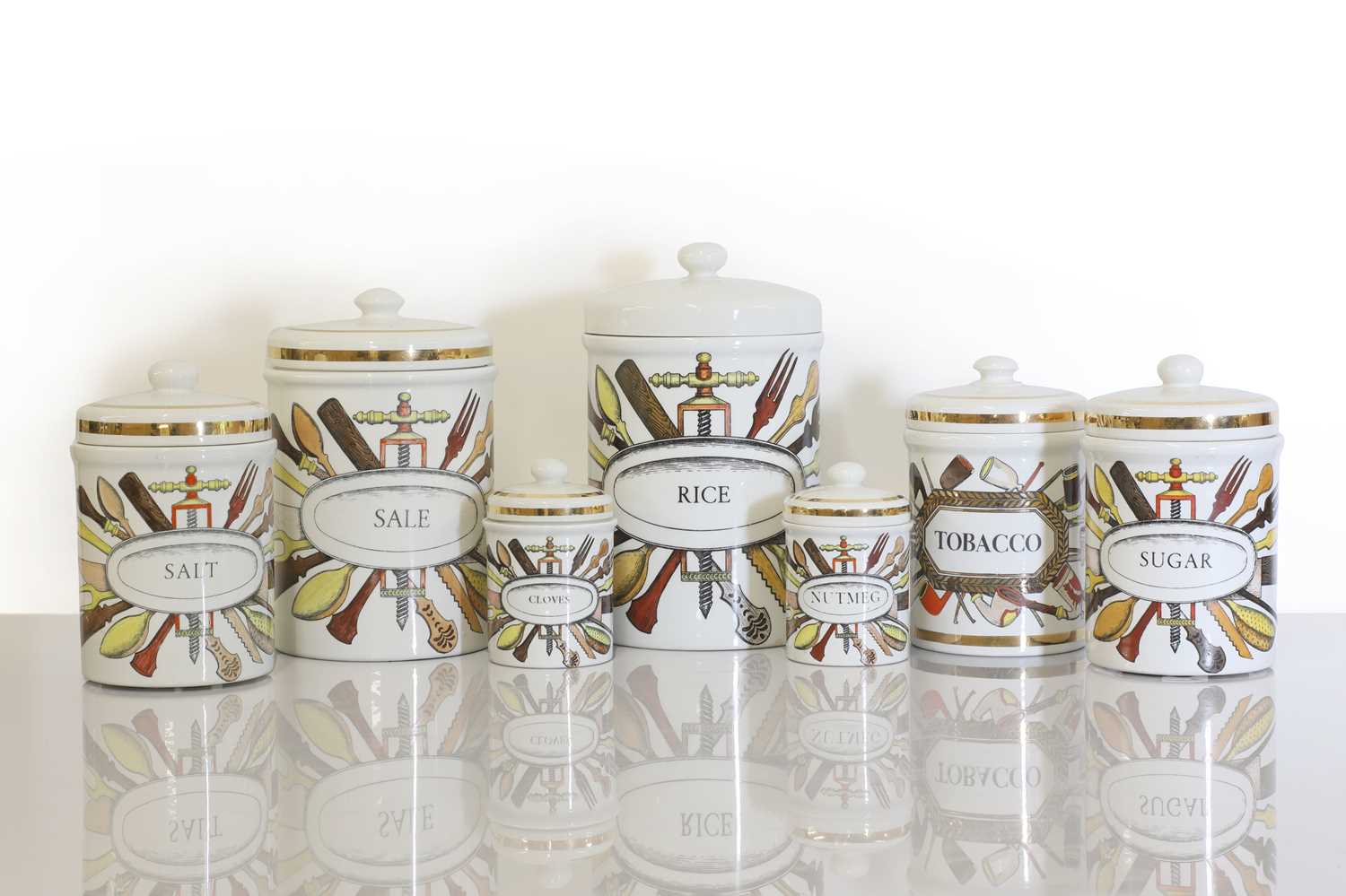 Lot 321 - A collection of six Italian Fornasetti porcelain spice jars