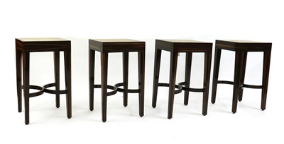 Lot 334 - A set of four Art Deco-style macassar ebony and faux shagreen tables