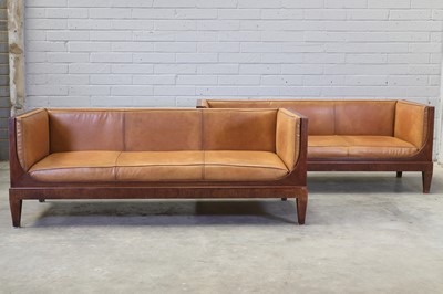 Lot 305 - A pair of oak and leather sofas