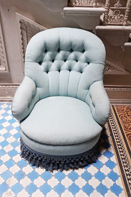 Lot 15 - A button-upholstered spoon-back armchair
