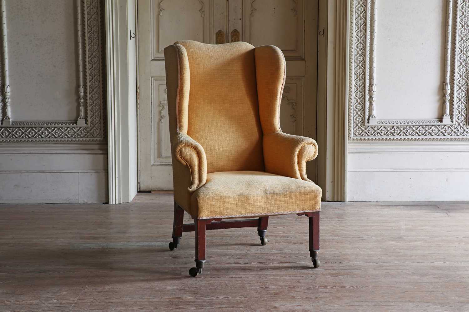 Lot 150 - ☘ A George III mahogany-framed wingback armchair