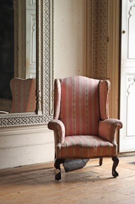 Lot 34 - A mahogany George III-style wingback armchair