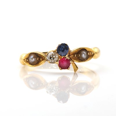 Lot 27 - A late Victorian ruby sapphire and diamond trefoil ring