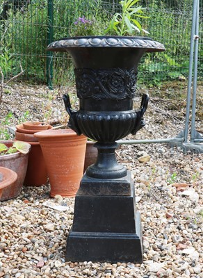 Lot 451 - A cast iron Campana form garden urn