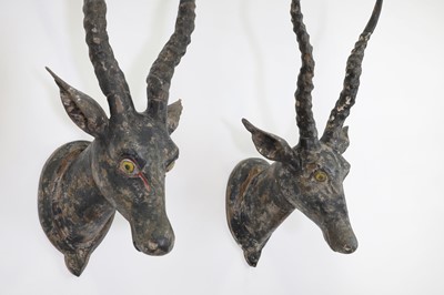 Lot 462 - A pair of carved antelope heads