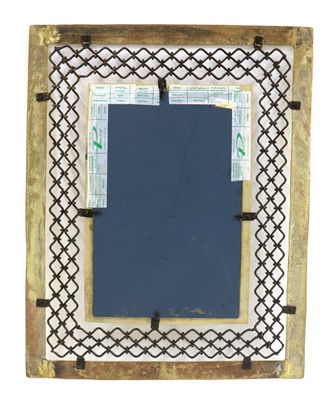 Lot 430 - A David Marshall brass and iron wall mirror
