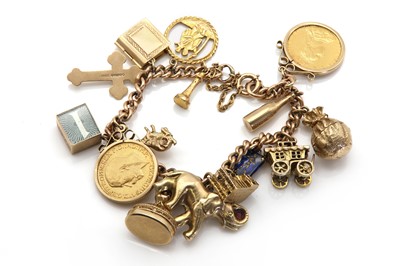 Lot 367 - A gold charm bracelet