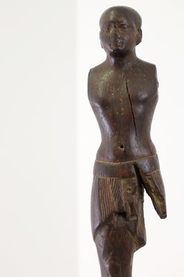 Lot 252 - An ancient Egyptian carved wooden figure in the Middle Kingdom-style
