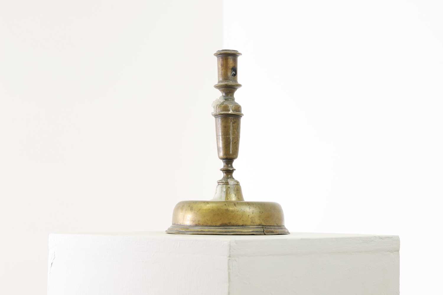 Lot 22 A brass candlestick,