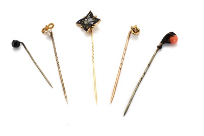 Lot 301 - Three gold stick pins